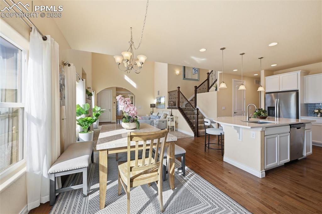 Image 22 of 45: View From Dining Area Looking Into The Living Room And Staircase To Second 