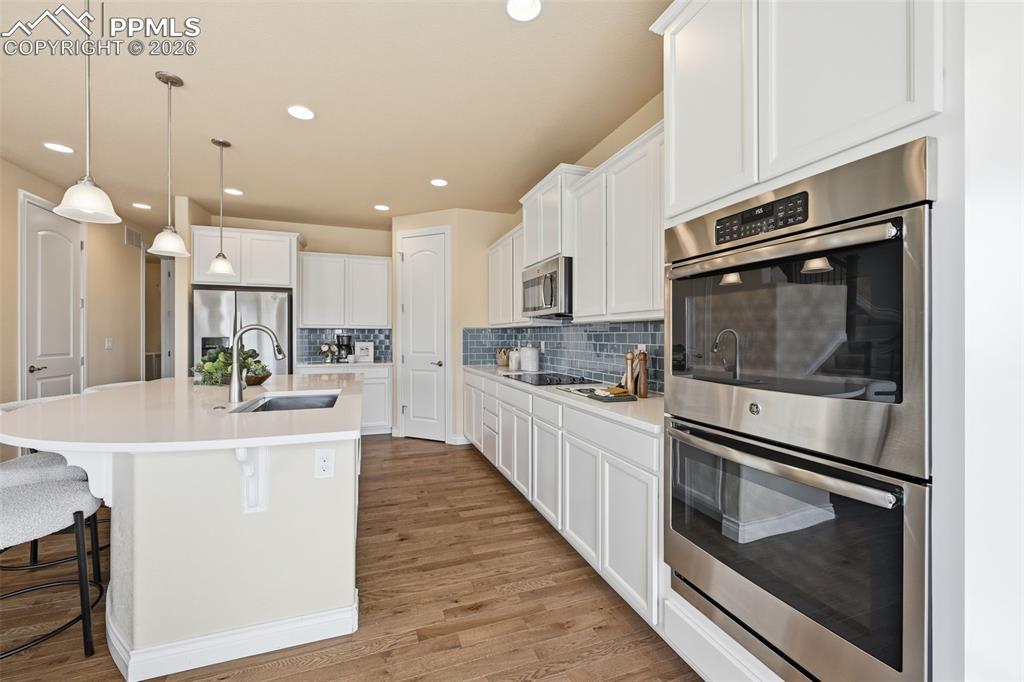 Image 23 of 45: Kitchen, Double Ovens and Electric CookTop, Gas Is Already Plumbed In If Yo