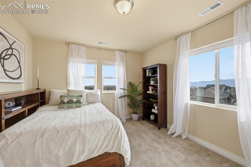 Image 37 of 45: Second Floor West Side Bedroom, With View of Pikes Peak.