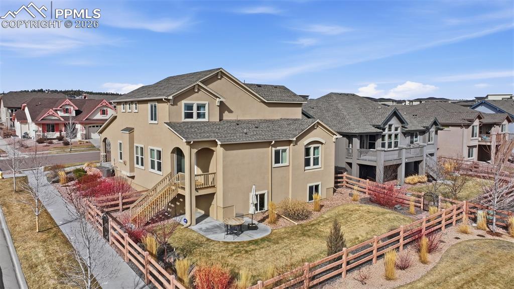 Image 9 of 45: Back View Of Home.  All Landscaping, Mowing, Plants and Watering Paid For A