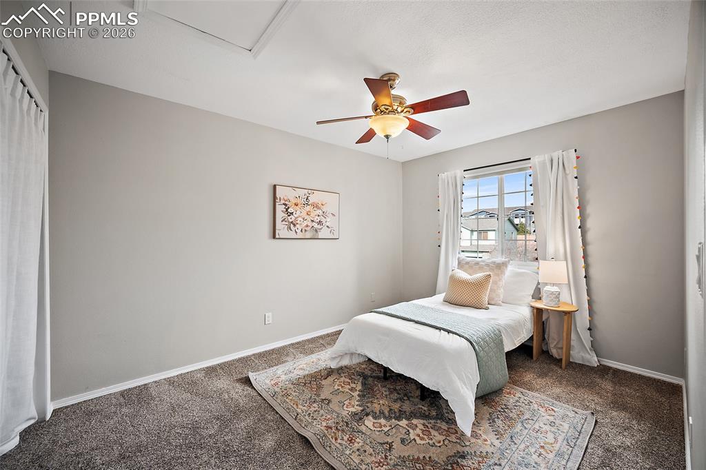 Image 22 of 46: Carpeted bedroom featuring baseboards and a ceiling fan