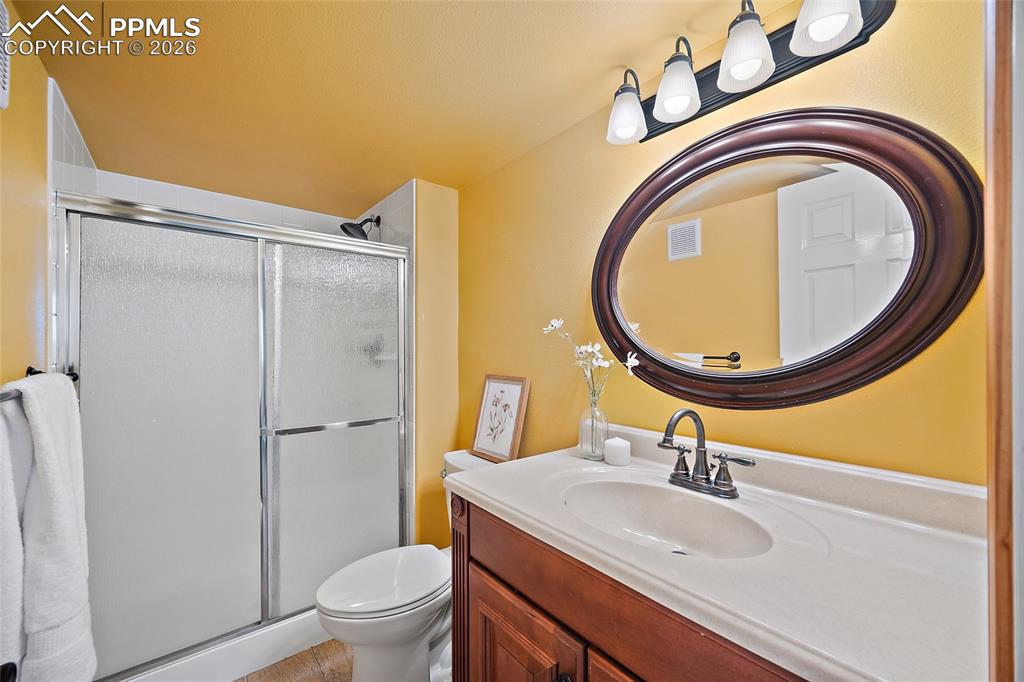 Image 26 of 46: Full bath with vanity and a stall shower