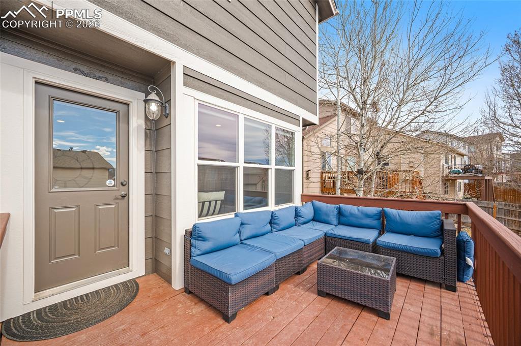 Image 32 of 46: Wooden deck with an outdoor living space