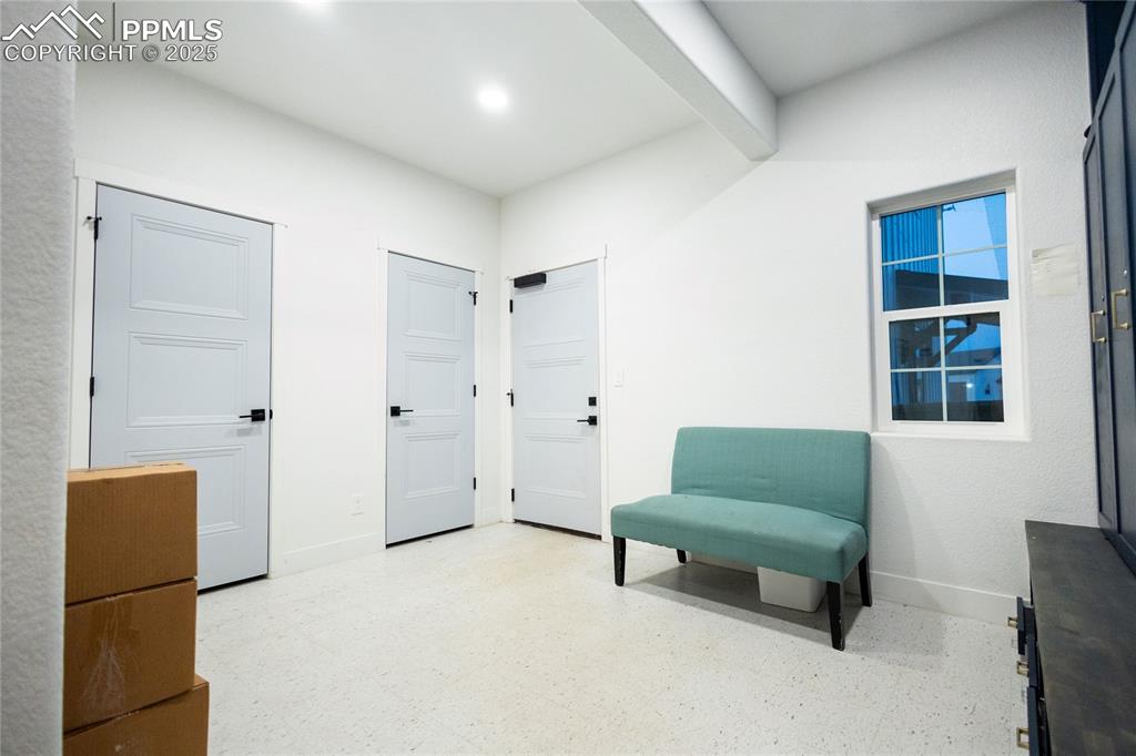 Image 19 of 44: Mud Room with light flooring and beamed ceiling