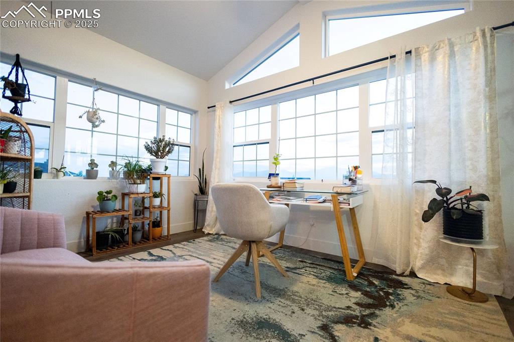 Image 22 of 44: vaulted ceiling and wood finished floors