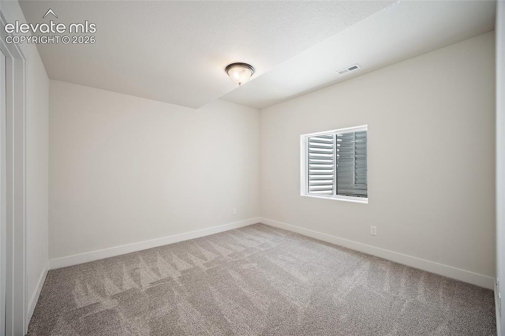 Image 42 of 48: Basement Bedroom