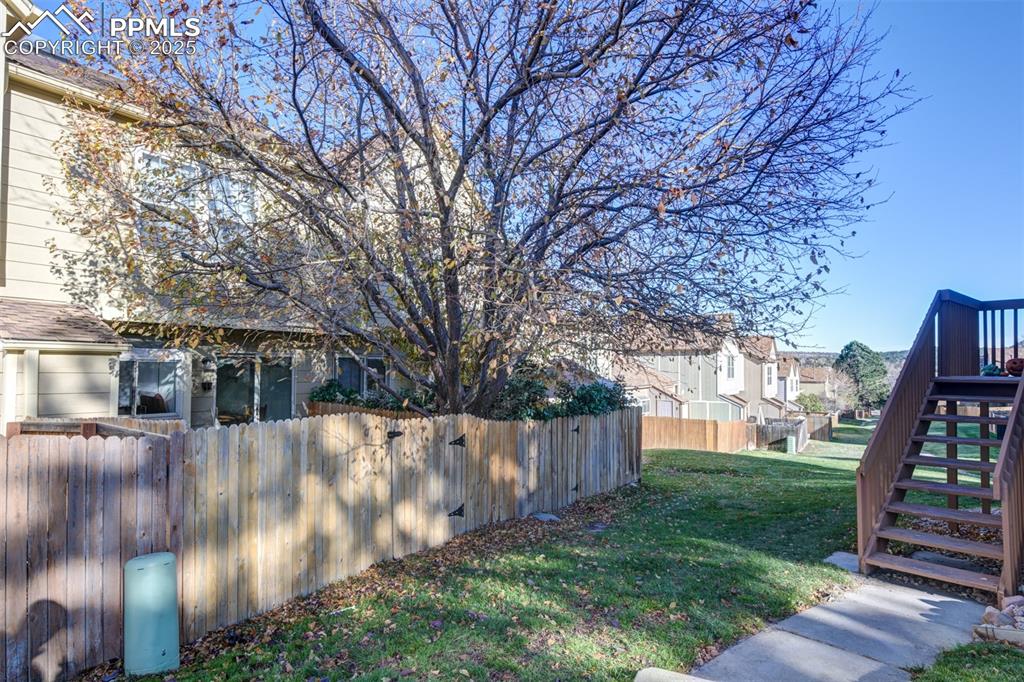 Image 23 of 25: Back yard has a gate to the green zones