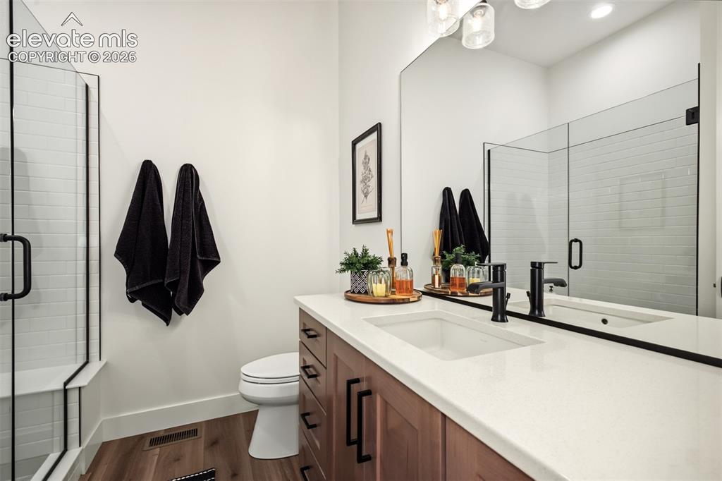 Image 26 of 50: Beautifully appointed main-level bathroom featuring a spacious vanity, mode
