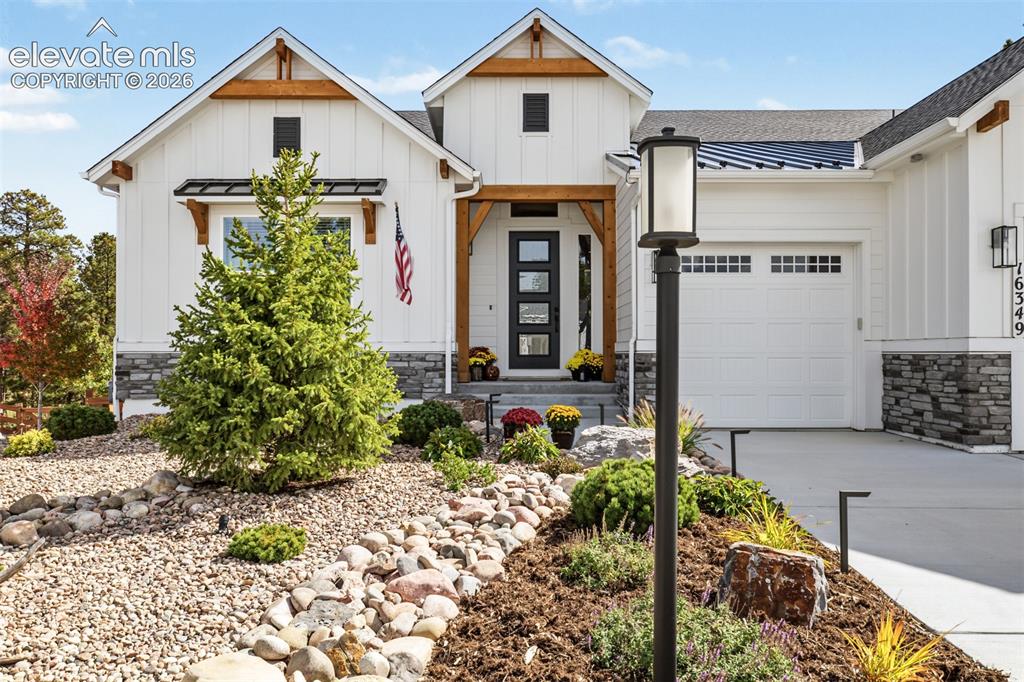 Image 3 of 50: Beautiful architectural details, stone accents, professional landscaping, a