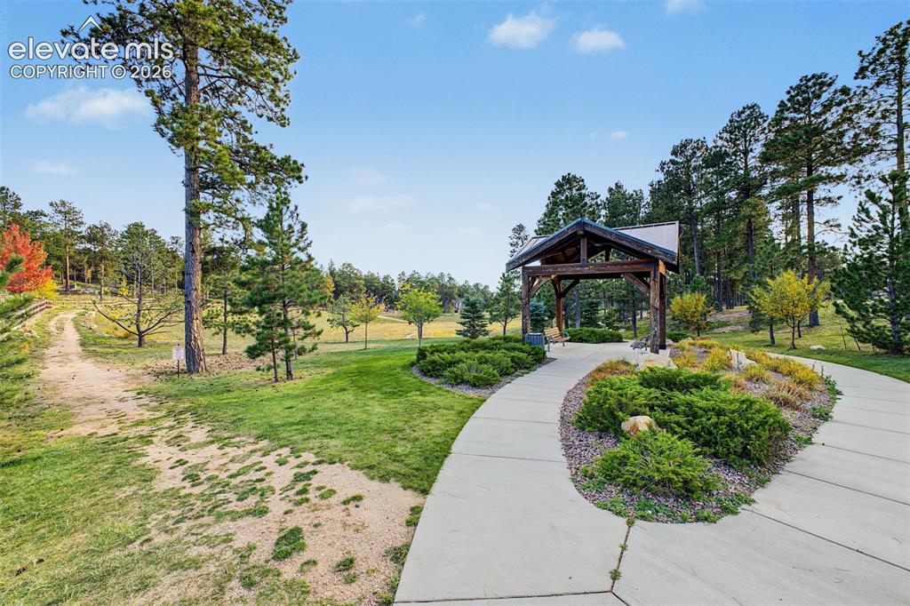 Image 50 of 50: Beautifully landscaped Sanctuary Pointe pocket park featuring winding walki