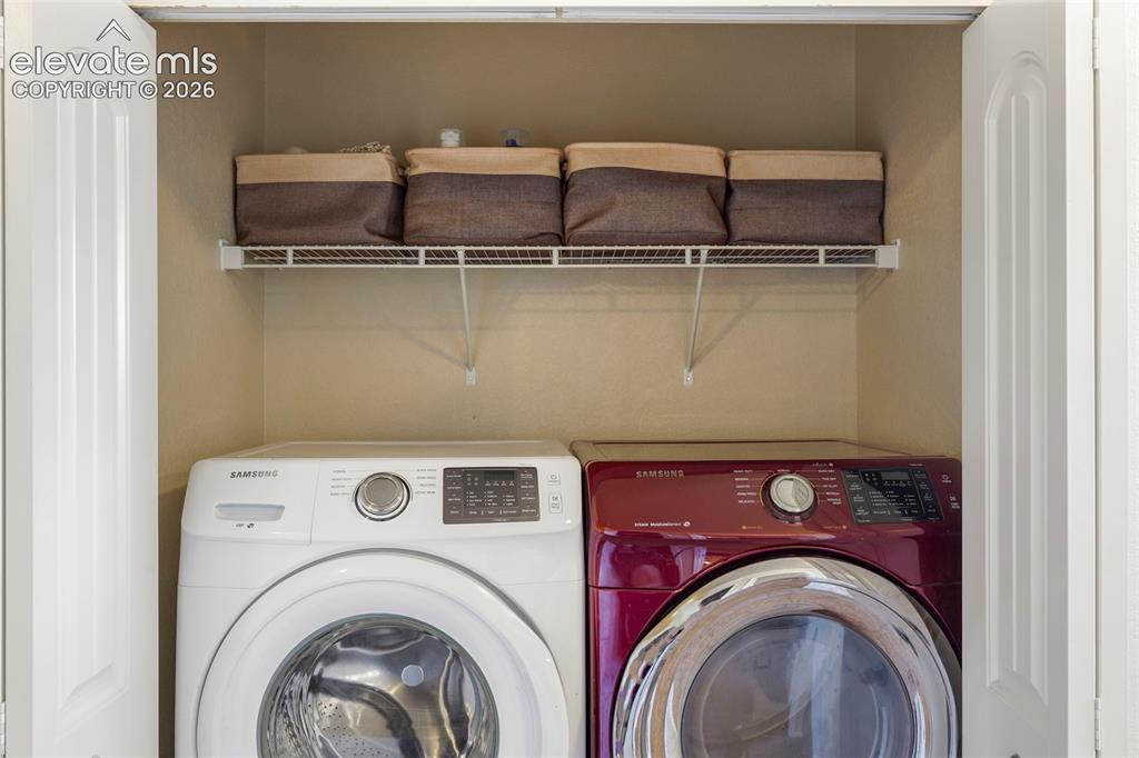 Image 12 of 32: Laundry closet with wire shelving