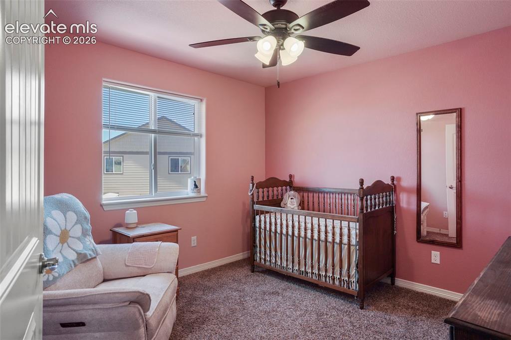 Image 18 of 32: Recessed window with blinds, ceiling fan with integrated lighting, and carp