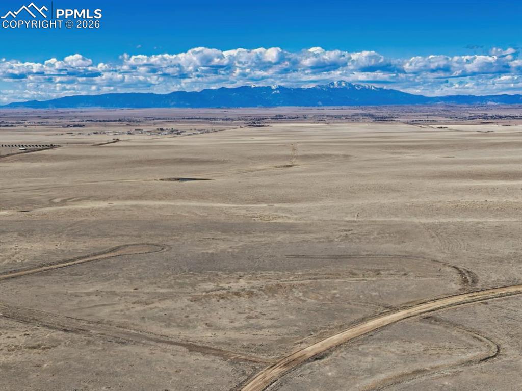 Caption: Corner Lot Setting with Big Sky Backdrop
Positioned on a desirable corner location, Lot 38 offers a