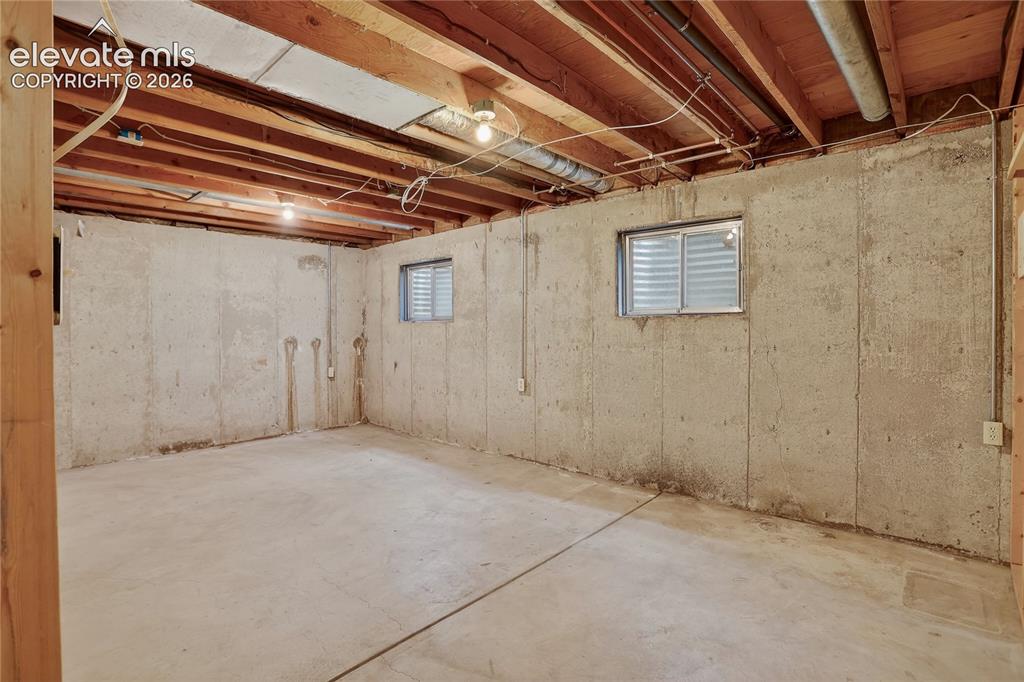 Image 17 of 21: Unfinished basement provides storage space