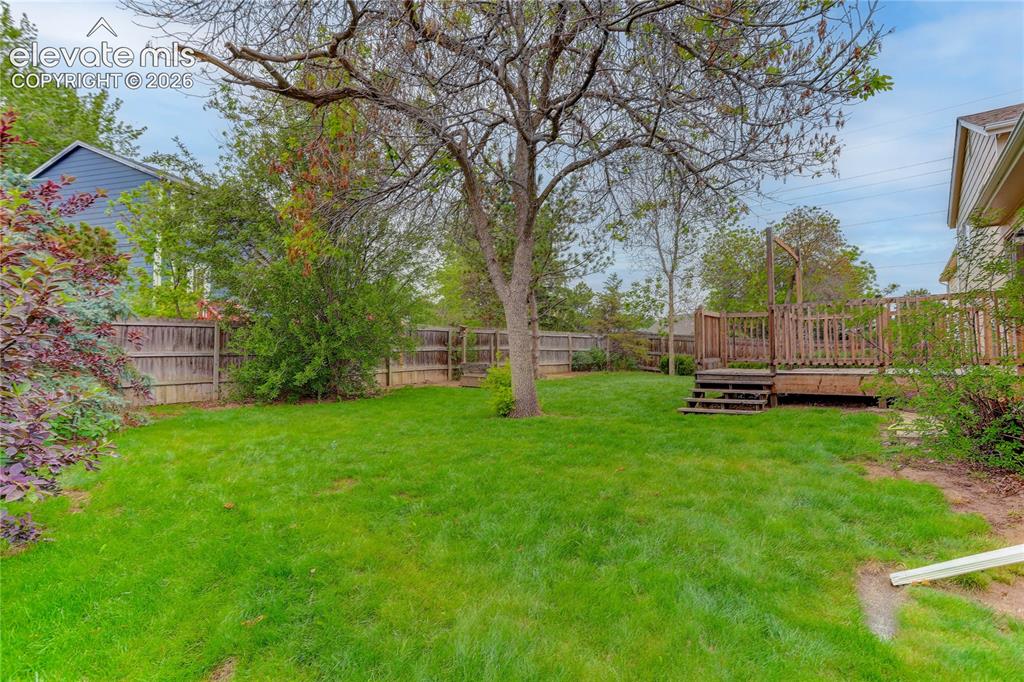 Image 19 of 21: Fully fenced backyard