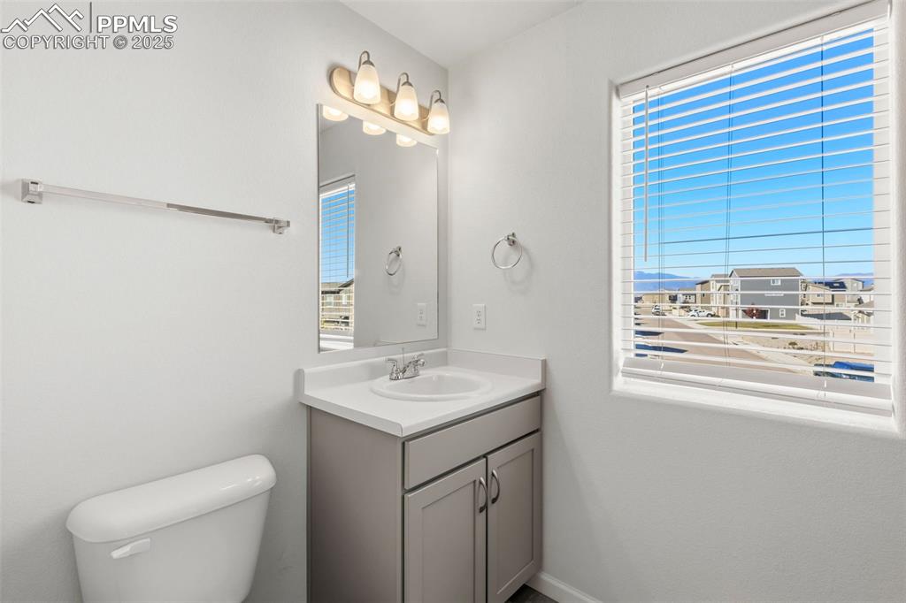 Image 25 of 35: Bathroom featuring vanity and toilet