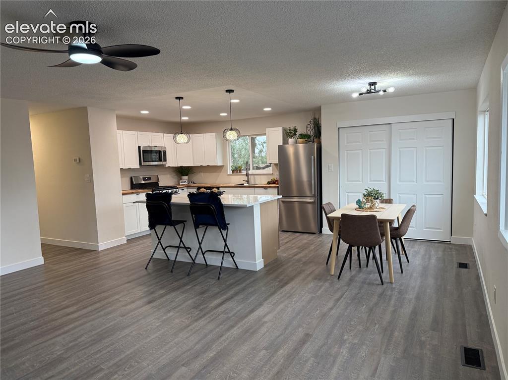 Image 10 of 25: Beautifully renovated kitchen with2 tone cabinets and stainless steel appli