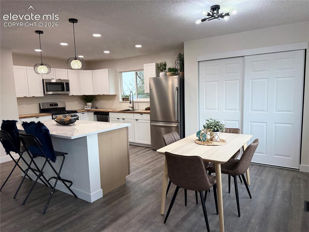 Image 11 of 25: Plenty of room to cook and gather in the kitchen