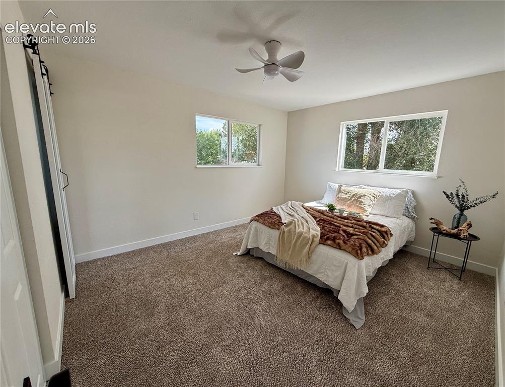 Image 15 of 25: shows with queen sized bed. King with fit nicely