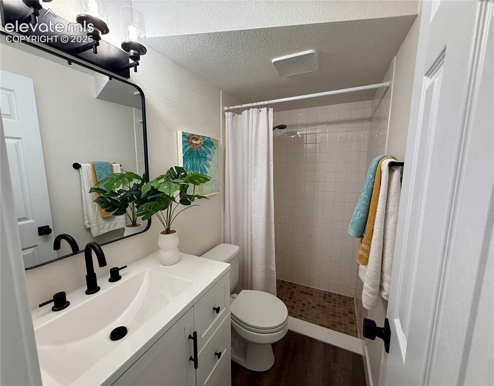 Image 21 of 25: Lower level bathroom- newly renovated