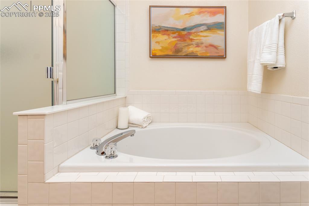 Image 24 of 40: Full bath with a bath