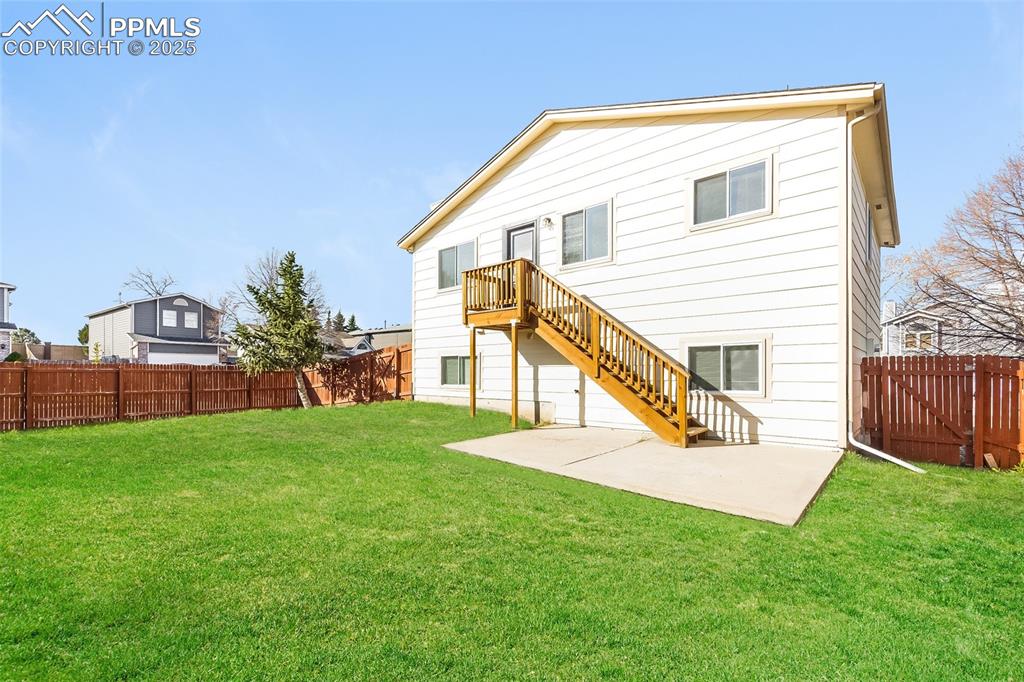 Image 24 of 25: Back of property with a patio area