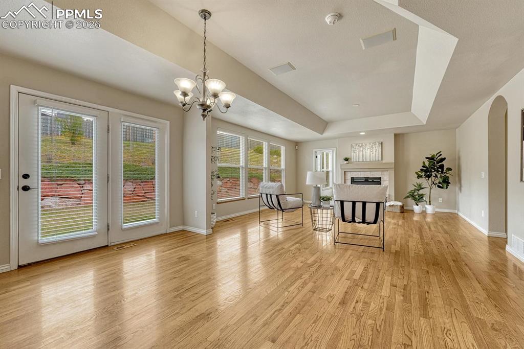 Image 12 of 47: Breakfast nook area opens to family room with gas fireplace and hardwood!