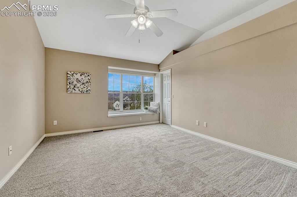 Image 24 of 47: Spacious upper level secondary bedrooms with vaulted ceilings and natural l