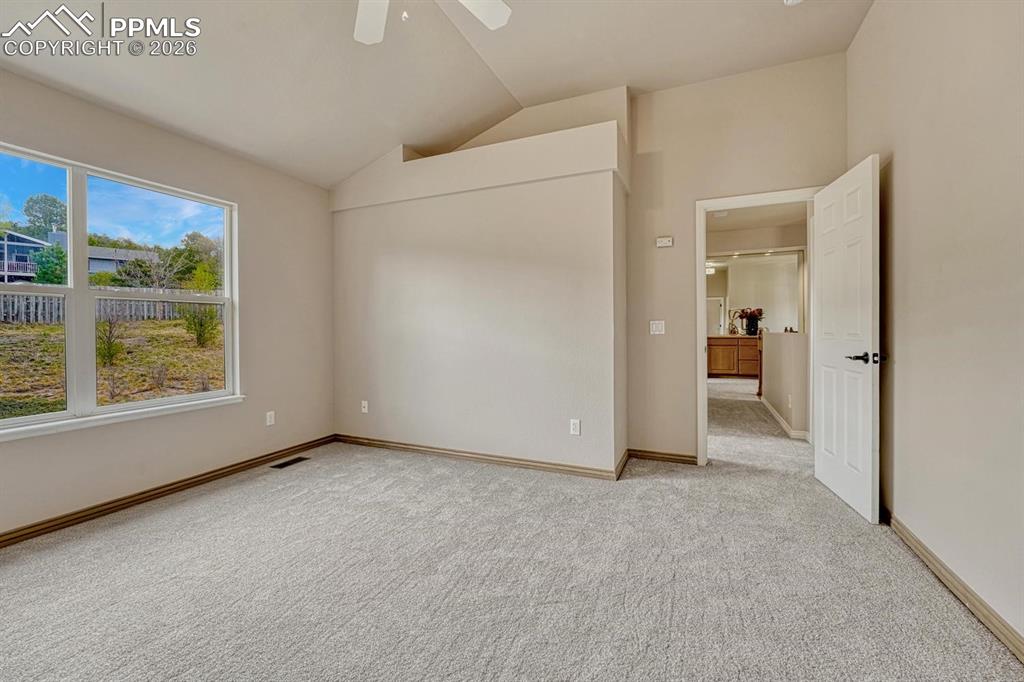 Image 25 of 47: Spacious upper level secondary bedrooms with vaulted ceilings and natural l