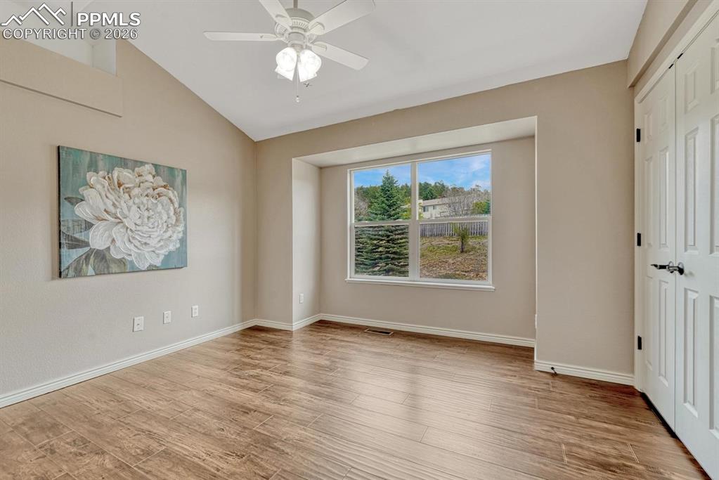 Image 27 of 47: Spacious upper level secondary bedrooms with vaulted ceilings and natural l