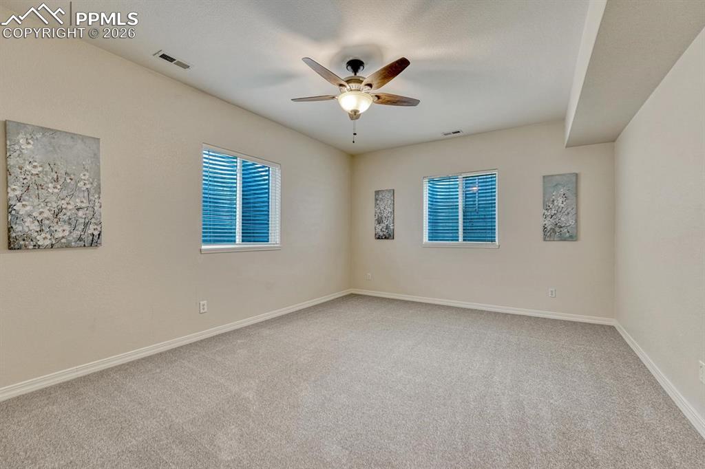 Image 36 of 47: Spacious 5th Bedroom in basement with 2 windows for light!