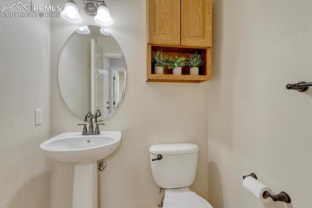 Image 38 of 47: Main level half bath