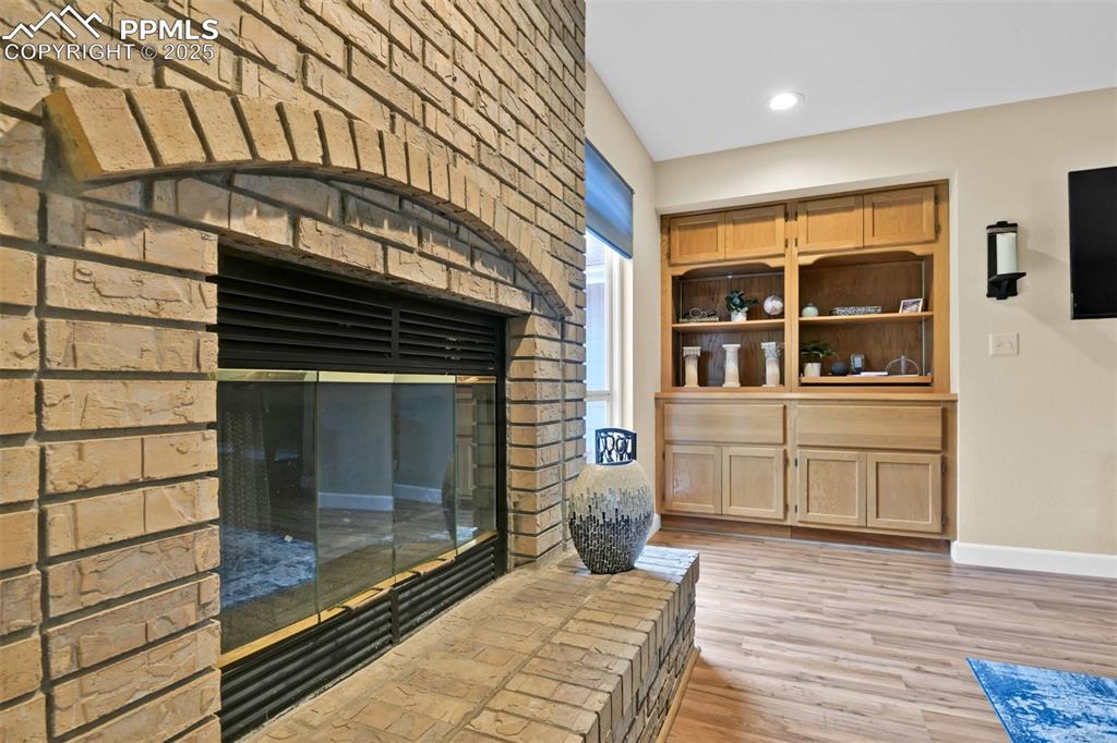 Image 20 of 50: Detailed view of wood finished floors and recessed lighting