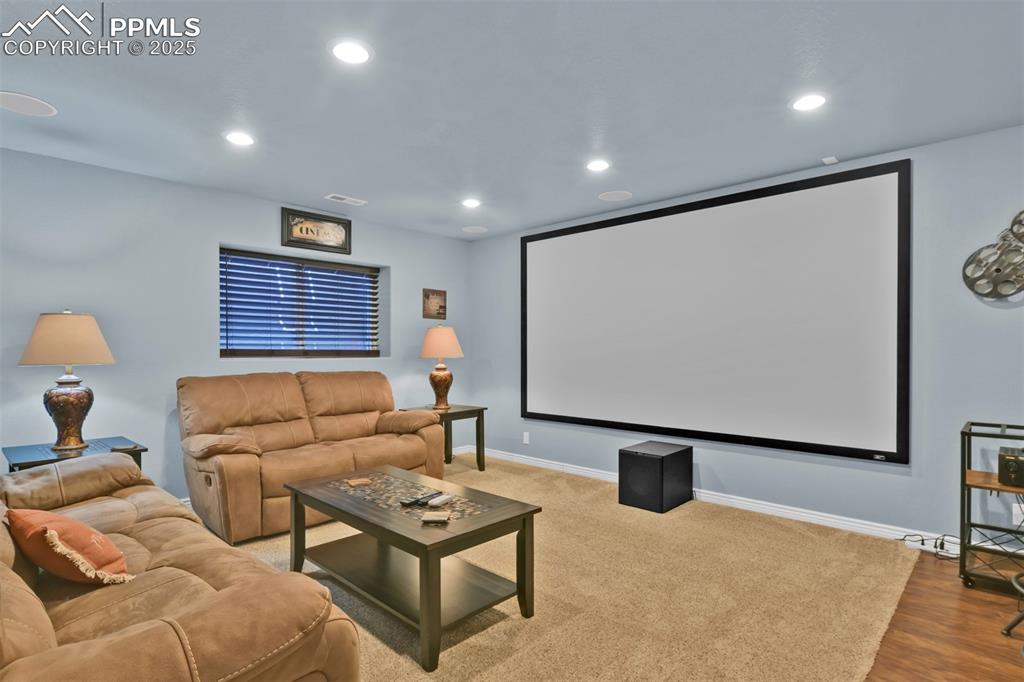 Image 39 of 50: Cinema featuring recessed lighting and wood finished floors