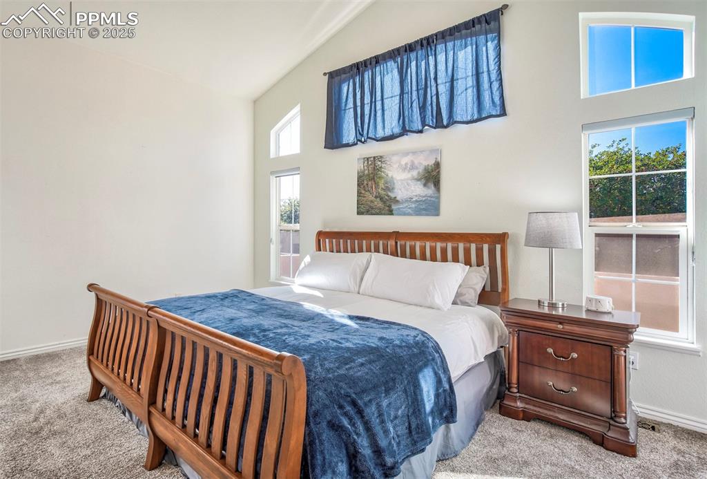 Image 21 of 33: Main Bedroom Suite with vaulted ceilings and abundant light, Walk in Closet
