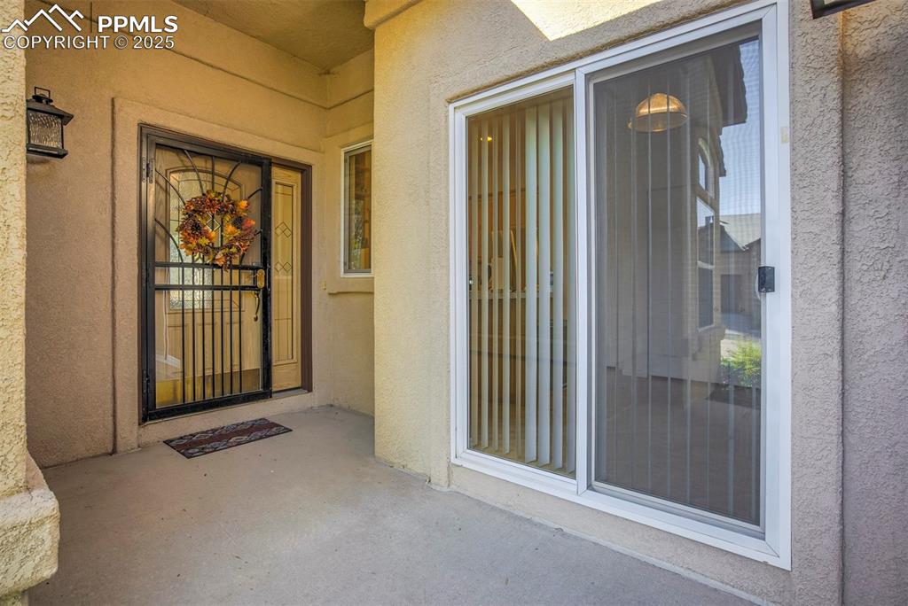 Image 4 of 33: View of exterior entry featuring sliding door from kitchen