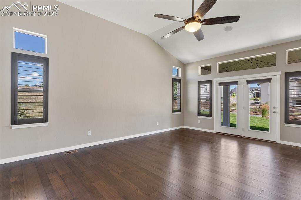 Image 13 of 49: Gorgeous primary bedroom featuring vaulted ceiling, upgraded shutter blinds