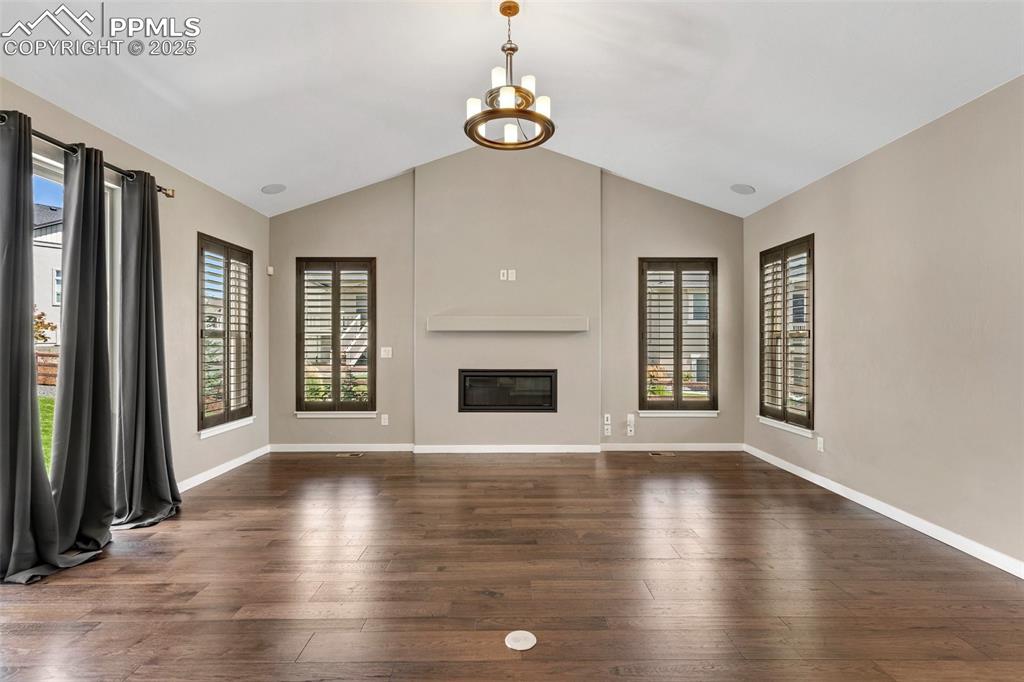 Image 23 of 49: Cozy up by the fireplace