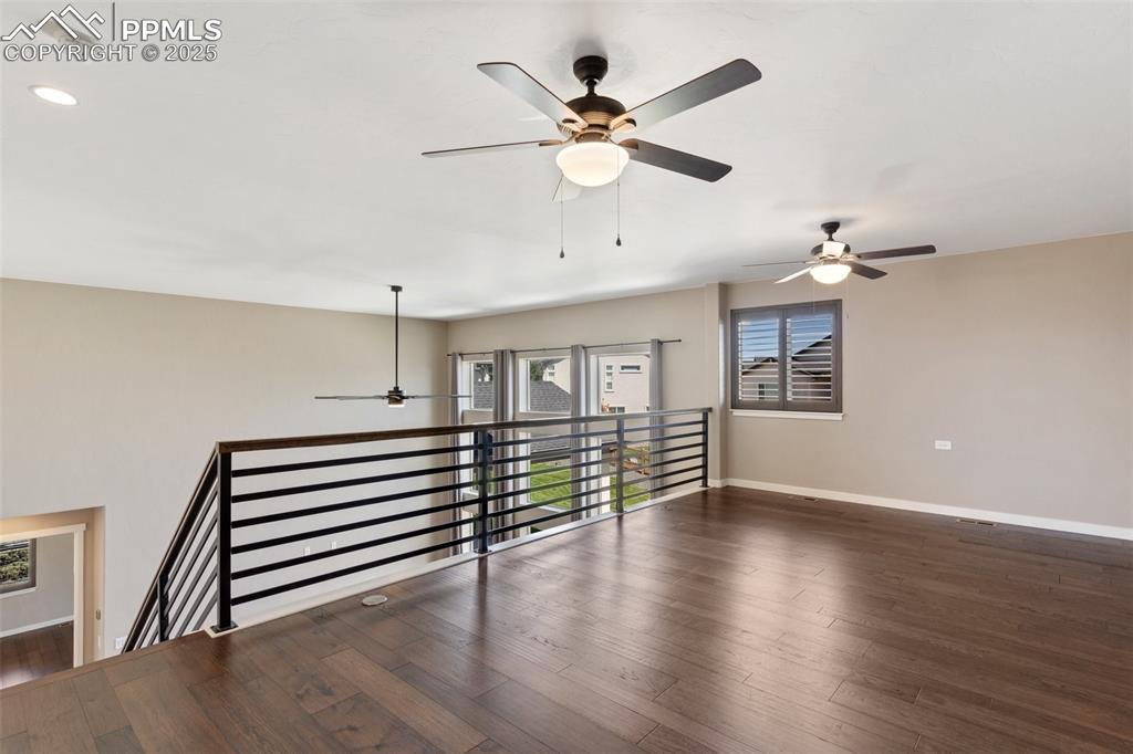 Image 26 of 49: Loft area overlooking the living room could be used as an office, play area