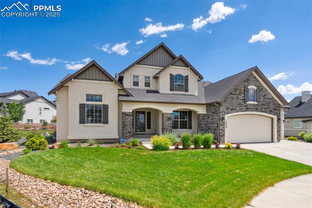 Image 3 of 49: Impeccable landscaping gives this beautiful home excellent curb appeal