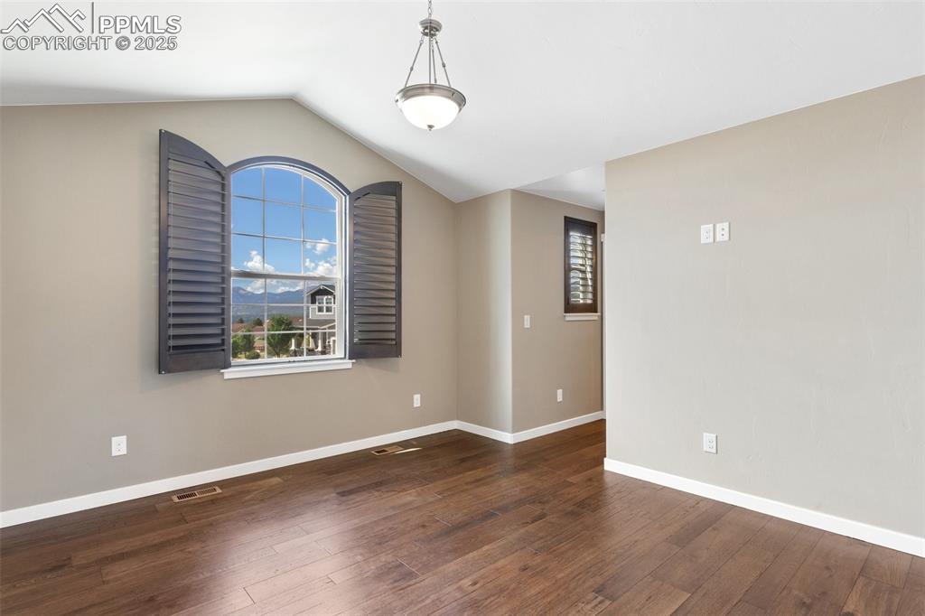 Image 30 of 49: Bedroom featuring beautiful mountain views and an ensuite bath