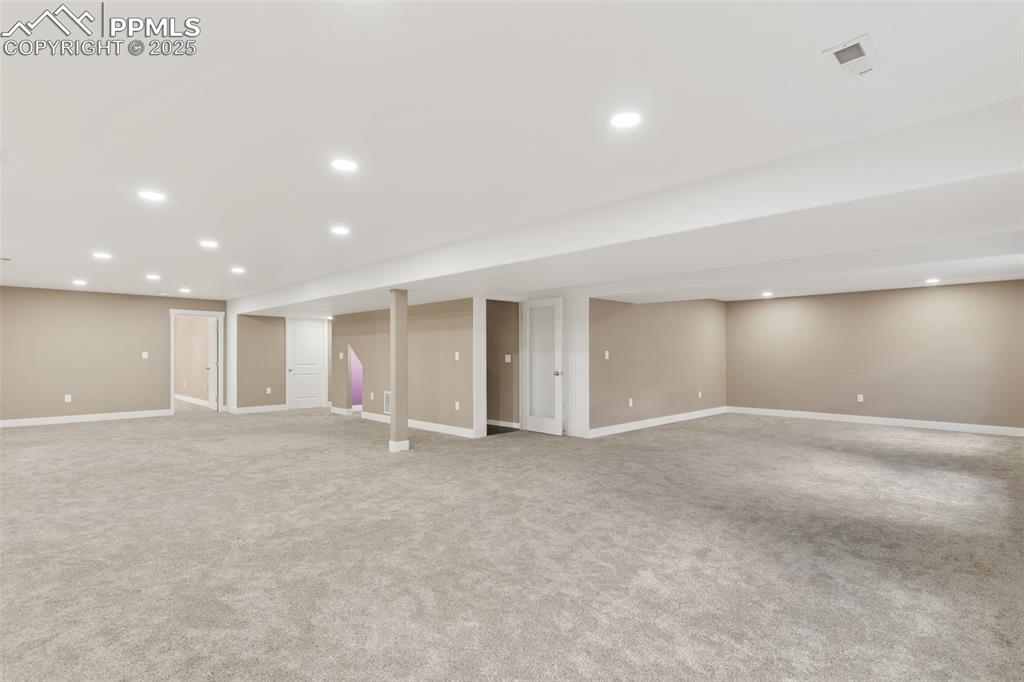 Image 33 of 49: Massive basement with room for a family room, home gym, storage, and more