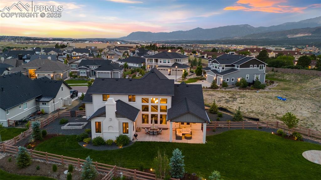 Image 40 of 49: Retreat to the backyard oasis featuring a stunning mountain backdrop, cover