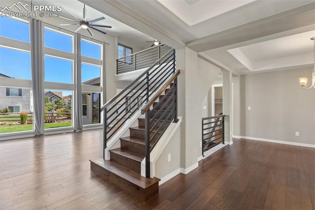 Image 9 of 49: View of the living room featuring a towering ceiling and breathtaking floor