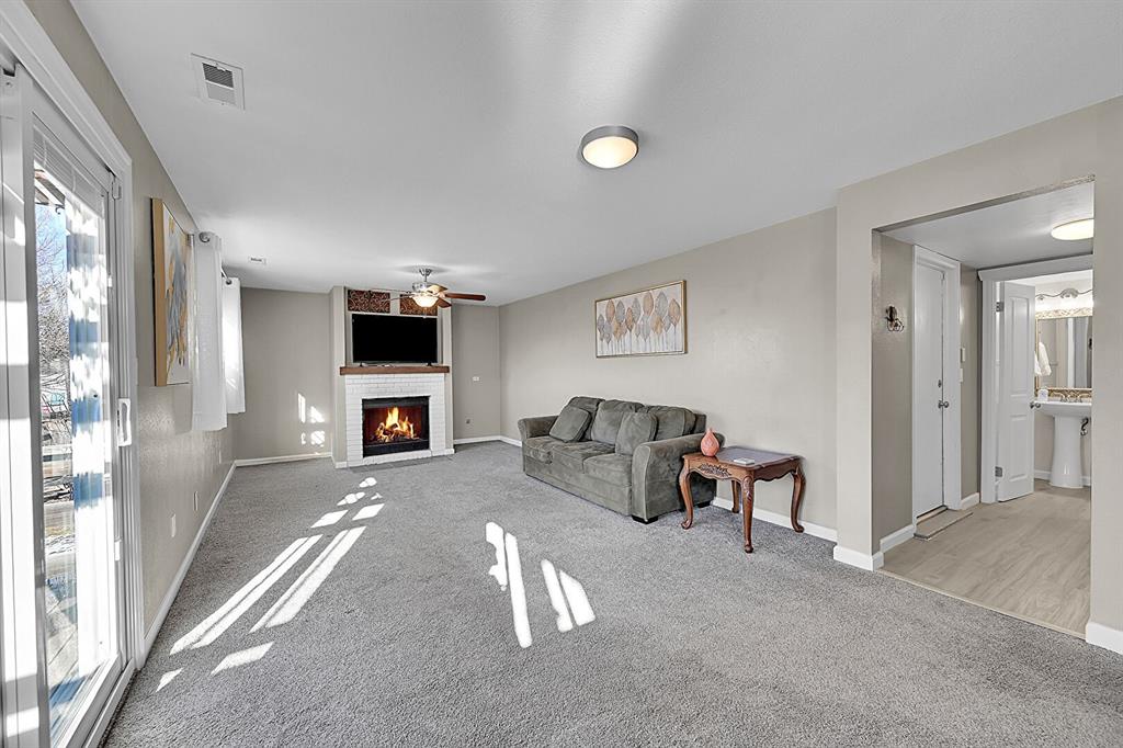 Image 13 of 45: Lighted ceiling fan and lots of windows!