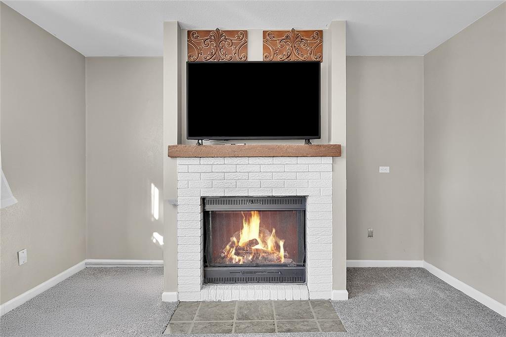 Image 14 of 45: The gas log fireplace is great for the cool Colorado evenings!
