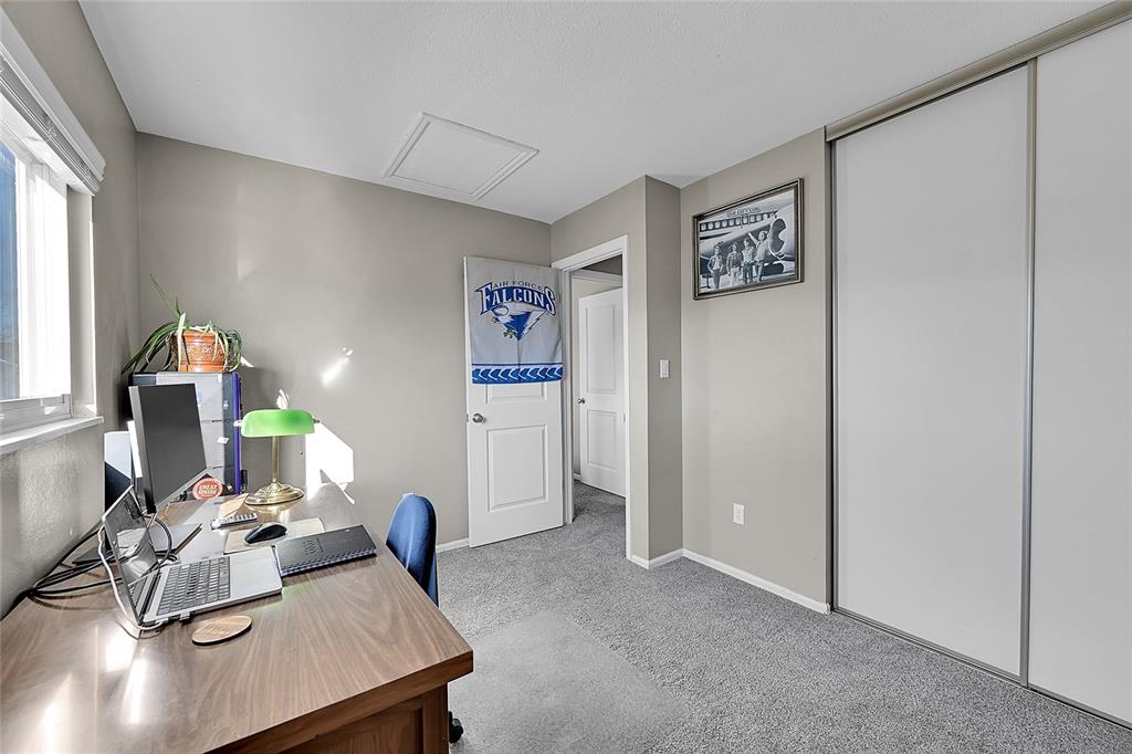 Image 26 of 45: Office space featuring light carpet and attic access