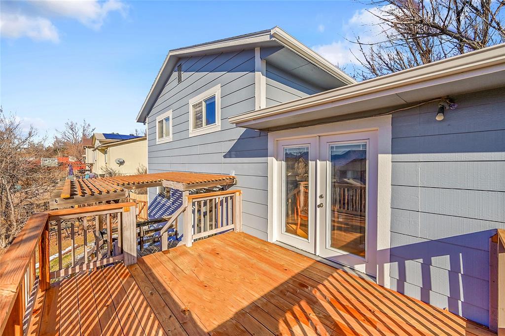 Image 28 of 45: Large deck, opening to the kitchen,  makes entertaining easy!