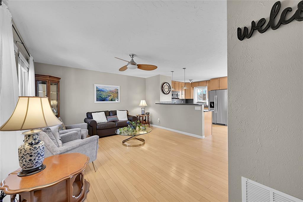Image 4 of 45: Formal living room with wood flooring! 