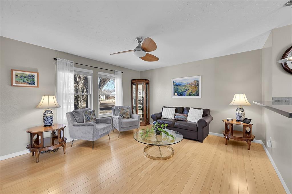 Image 5 of 45: Large window makes this living room light and bright!!